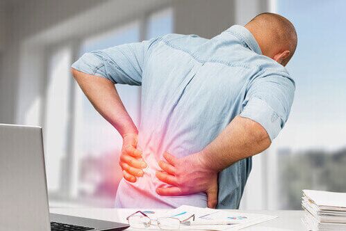 Sharp back pain due to overexertion or injury